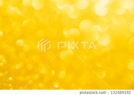 Yellow colored large and small sparkling background material 132989192