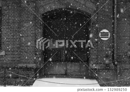 Snow-covered brick warehouse 132989250