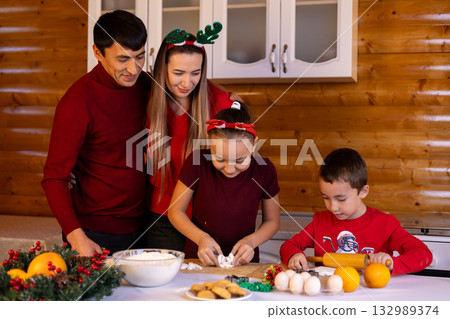 The family is joyfully preparing Christmas cookies together 132989374