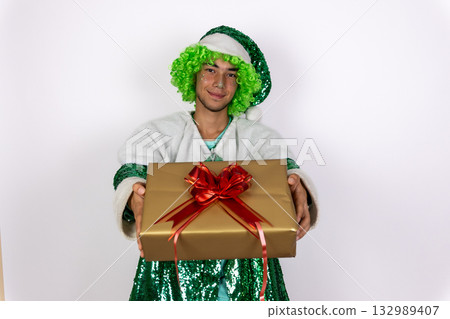 An elf is presenting a Christmas gift An elf is presenting a Christmas gift 132989407