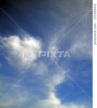 White clouds floating in the blue sky look like something, I wonder what it is White clouds floating in the blue sky look like something, I wonder what it is 132989442