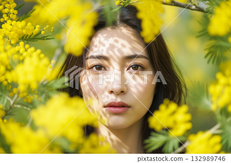 Woman Surrounded by Mimosa Flowers International Women's Day Woman Surrounded by Mimosa Flowers International Women's Day 132989746