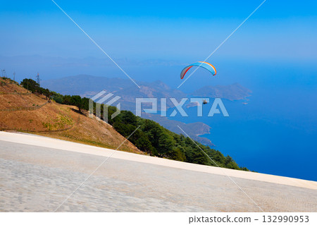 Flying paraglider at Babadag mountain in Turkey 132990953