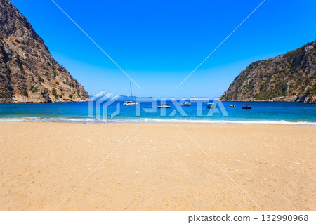 Butterfly Beach near Oludeniz village, Fethiye district in Turkey Butterfly Beach near Oludeniz village, Fethiye district in Turkey 132990968