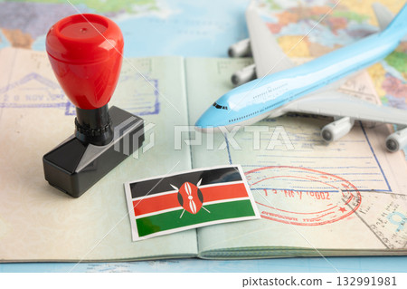Kenya flag with passport and airplane for travel. 132991981