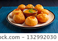 India Street Food, Plate of crispy pani puri filled with tangy tamarind water and spicy mashed potat 132992030