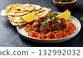 Pakistan food, Plate of spicy nihari with tender beef, served with naan and lemon wedges 132992032