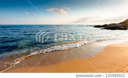 panoramic view of sand beach in bulgaria landscape. summer vacation season at the black sea on a sunny day. beautiful seaside of sozopol with calm water. wide coast travel banner 132995022