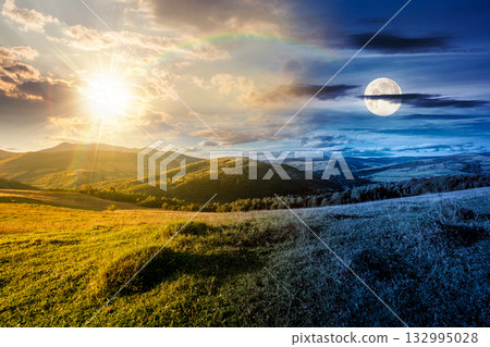 beautiful countryside. day and night time change concept. scenic view of grassy field and rolling hills. wonderful summertime landscape in mountains with sun and moon. duality and transition template 132995028