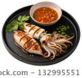 grilled squid served on a black plate 132995551