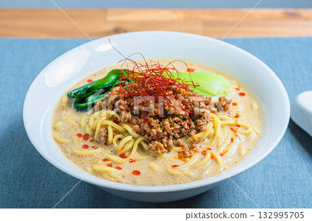 Soy milk sesame dandan noodles, Dandan noodles and bok choy served in a white bowl 132995705
