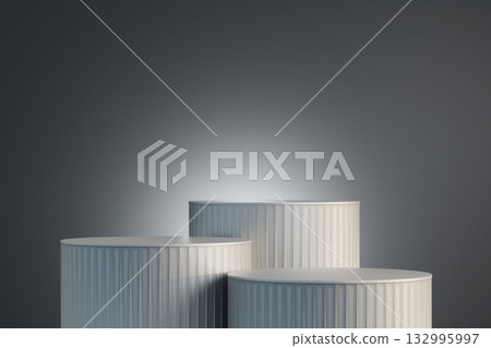 Gray three cylindrical podiums are standing still,ready to display a product 132995997