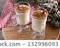 Eggnog with Cinnamon and Christmas Decorations 132996093