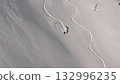 Professional skier making turns on a snowy slope 132996235
