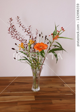Autumnal gerbera arrangement 132996359