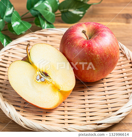 Apples (Early Fuji) served on a bamboo basket Apples (Early Fuji) served on a bamboo basket 132996614