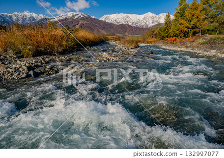 Hakuba mountains dyed in autumn leaves Hakuba mountains dyed in autumn leaves 132997077