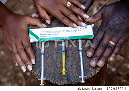 Needle medicinal pregnancy maternity baby bump couple hands details Needle medicinal pregnancy maternity baby bump couple hands details 132997314