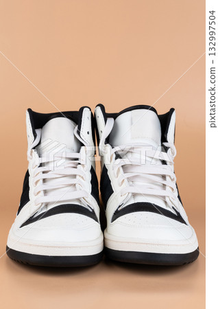 Pair of black white casual sport shoes 132997504