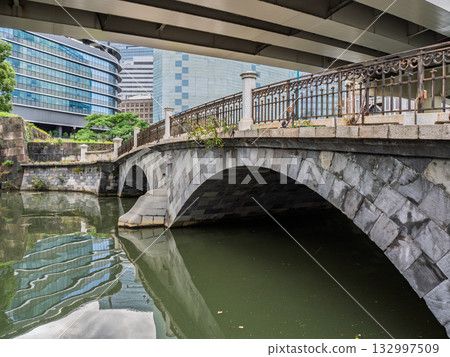 Metropolitan Expressway runs over the Nihonbashi River, and Tokiwa Bridge spans the Nihonbashi River Metropolitan Expressway runs over the Nihonbashi River, and Tokiwa Bridge spans the Nihonbashi River 132997509