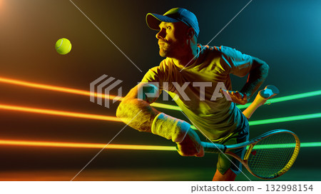 Tennis player concentrating before serve holding racket under vivid lights. Handmade collage Tennis player concentrating before serve holding racket under vivid lights. Handmade collage 132998154