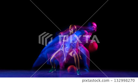 Female athlete shifting side to side with ball in motion blur. Female athlete shifting side to side with ball in motion blur. 132998270