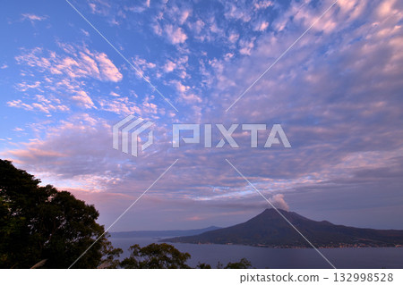 View of Sakurajima with smoke rising from the volcano near Sugiyama Park in Kagoshima 132998528