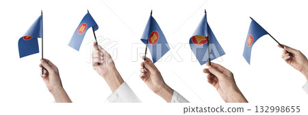 The ASEAN flag in hand in different angles on a white background 132998655