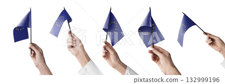 The European Union flag in hand in different angles on a white background 132999196