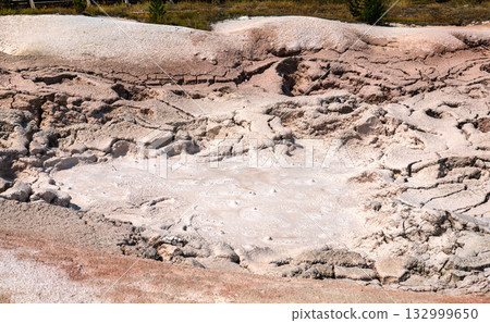 Close-up view of the bubbling, steaming mud at Fountain Paint Pot in Yellowstone National Park. The geothermal feature creates patterns in the thick, pinkish-gray mud Close-up view of the bubbling, steaming mud at Fountain Paint Pot in Yellowstone National Park. The geothermal feature creates patterns in the thick, pinkish-gray mud 132999650