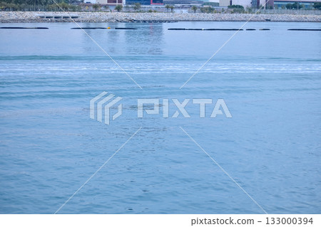 The seascape from the waterfront in Tung Chung, Hong Kong at sunset. Travel and nature scene. The seascape from the waterfront in Tung Chung, Hong Kong at sunset. Travel and nature scene. 133000394