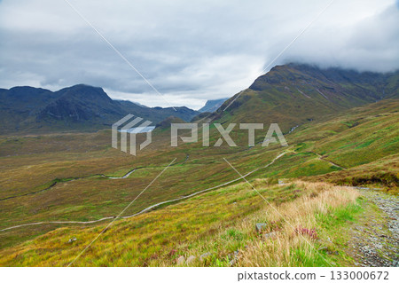 Skye Trail winding through moorland and mountains Isle of Skye Scotland Skye Trail winding through moorland and mountains Isle of Skye Scotland 133000672