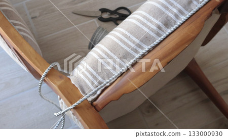 Anonymous person glues decorative braid. Antique furniture restoration. Crafts and hobbies. 133000930