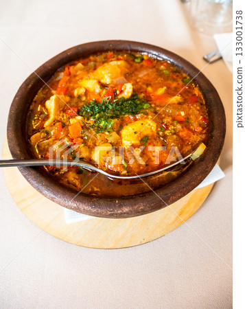 Georgian dish Chakhokhbili in ceramic bowl closeup Georgian dish Chakhokhbili in ceramic bowl closeup 133001738