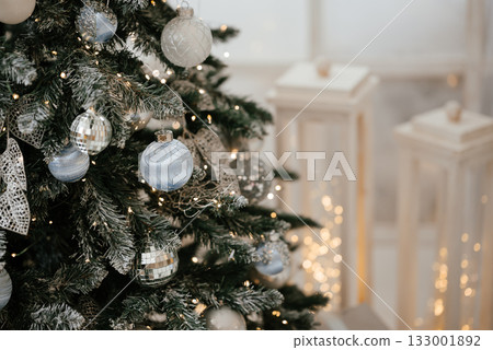 Elegant Christmas Tree with Silver and Blue Ornaments 133001892