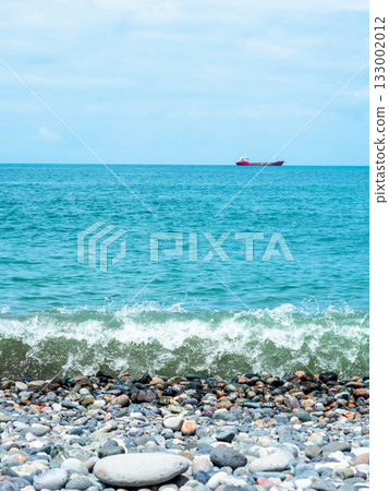 Black Sea with ship from pebble beach in Batumi 133002012