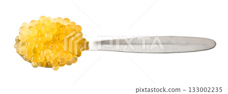 top view of yellow caviar of trout in spoon cutout 133002235