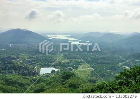 View of the beautiful jungle depths of Yanoda Park on Hainan Island, China. View of the beautiful jungle depths of Yanoda Park on Hainan Island, China. 133002279