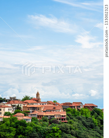 white clouds in blue sky over Sighnaghi town white clouds in blue sky over Sighnaghi town 133002323