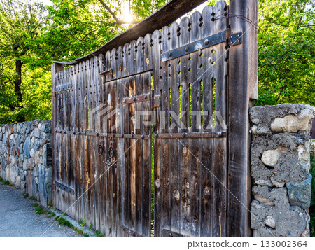 old wooden gates on street in Mestia town, Georgia 133002364