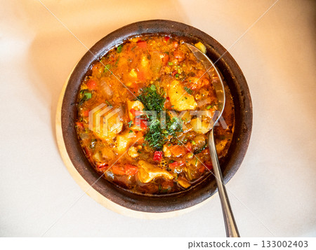 top view of Georgian dish Chakhokhbili in bowl 133002403