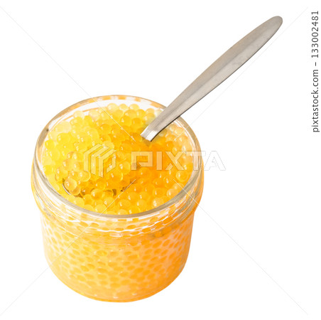 trout yellow caviar in glass jar with spoon cutout trout yellow caviar in glass jar with spoon cutout 133002481
