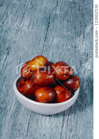 jujube fruits in a ceramic bowl jujube fruits in a ceramic bowl 133002538
