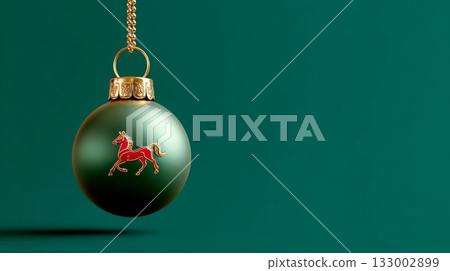 Green ornament with horse design hanging against a solid background for Chinese New Year celebration 133002899
