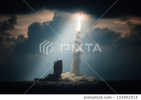 Naval warship launching missile at sea with dramatic clouds and sunlight breaking through 133002918