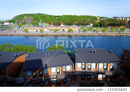 Sustainable cabins with natural materials on waterfront in Kvillepiren, Hisingen, sunny day, Gothenburg, Sweden Sustainable cabins with natural materials on waterfront in Kvillepiren, Hisingen, sunny day, Gothenburg, Sweden 133003689