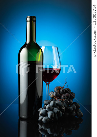 Red wine and juicy blue grapes. Red wine and juicy blue grapes. 133003714
