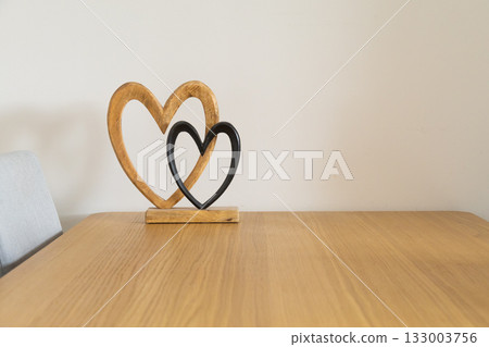 Wooden hearts on table. Love, connection, and gentle warmth of shared life and emotional closeness. Copy space Wooden hearts on table. Love, connection, and gentle warmth of shared life and emotional closeness. Copy space 133003756