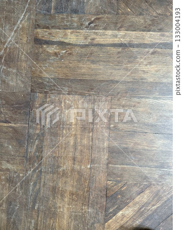 Wooden floor background with visible scratches and natural texture, ideal for design projects 133004193