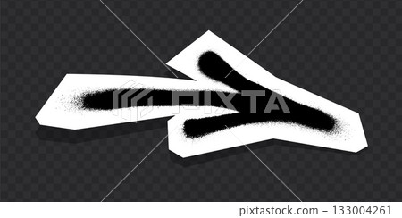 Graffiti-style black arrow with spray paint texture on white paper cutout. 133004261